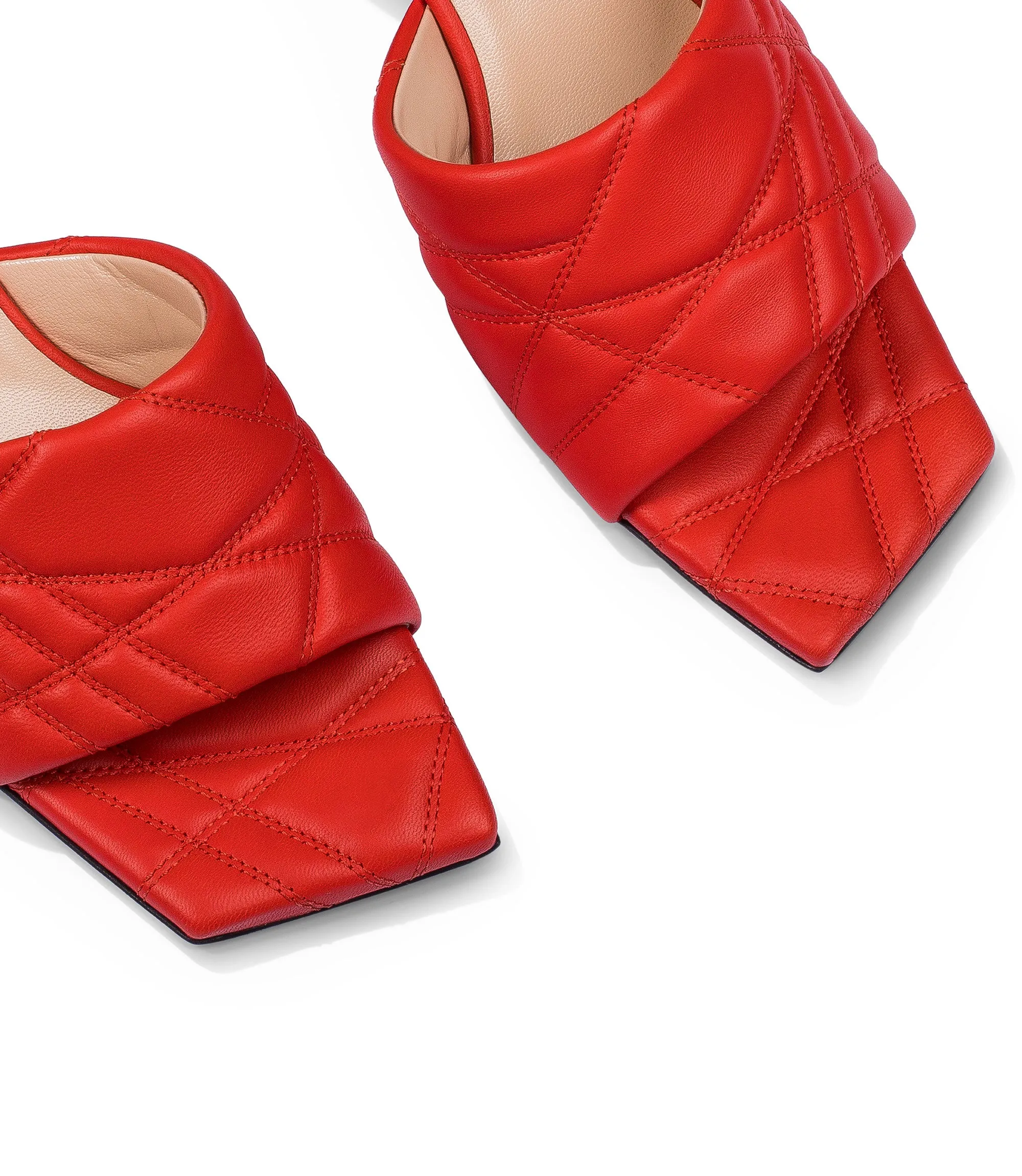 Coral red quilted nappa leather mules